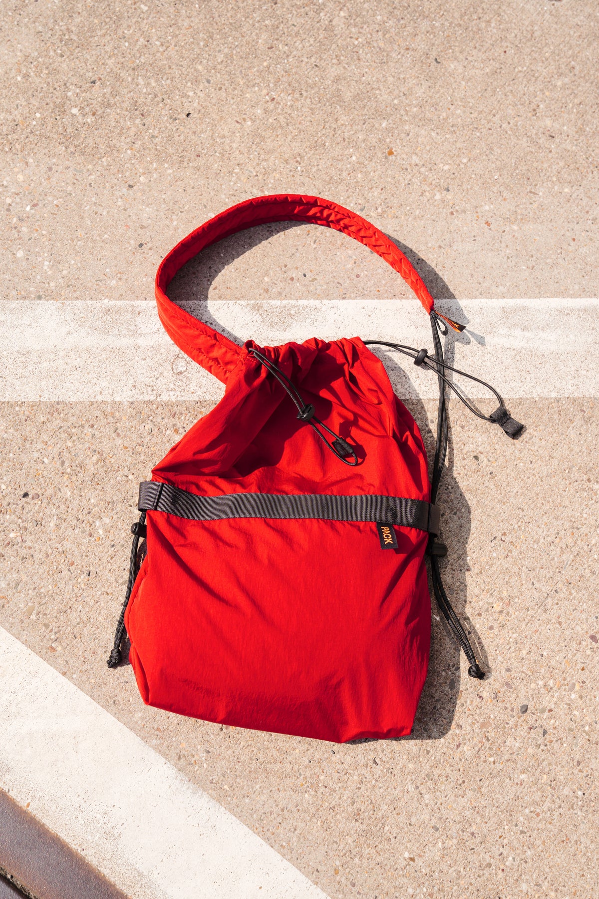 Medium Drawstring Sling with Padded Strap · A111